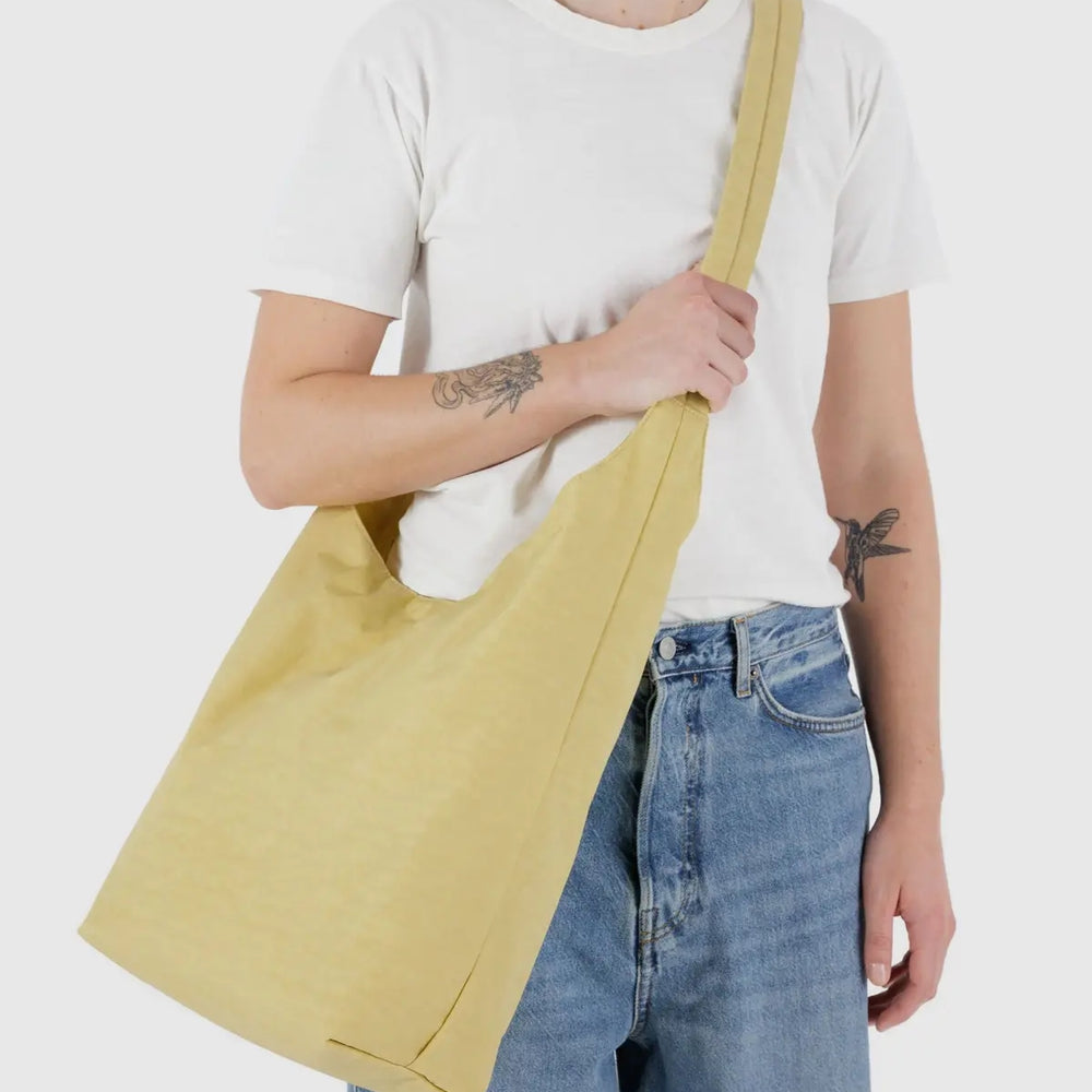 
                      
                        Large Nylon Sling Bag - Butter [PRE ORDER]
                      
                    