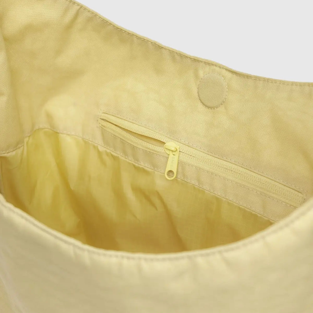 
                      
                        Large Nylon Sling Bag - Butter [PRE ORDER]
                      
                    