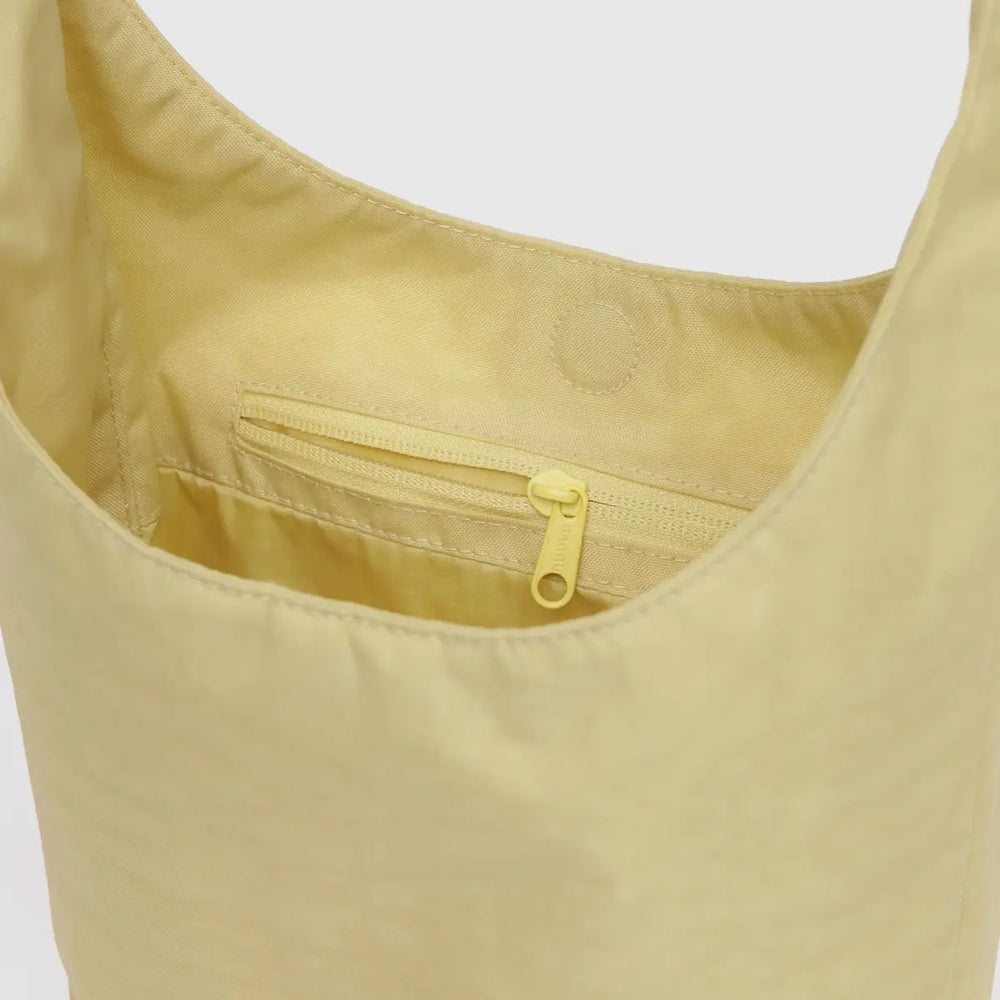 
                      
                        Small Nylon Sling Bag - Butter [PRE ORDER]
                      
                    